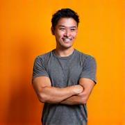 Portrait of an energetic male fitness expert, early 40s, with a fit physique and engaging smile